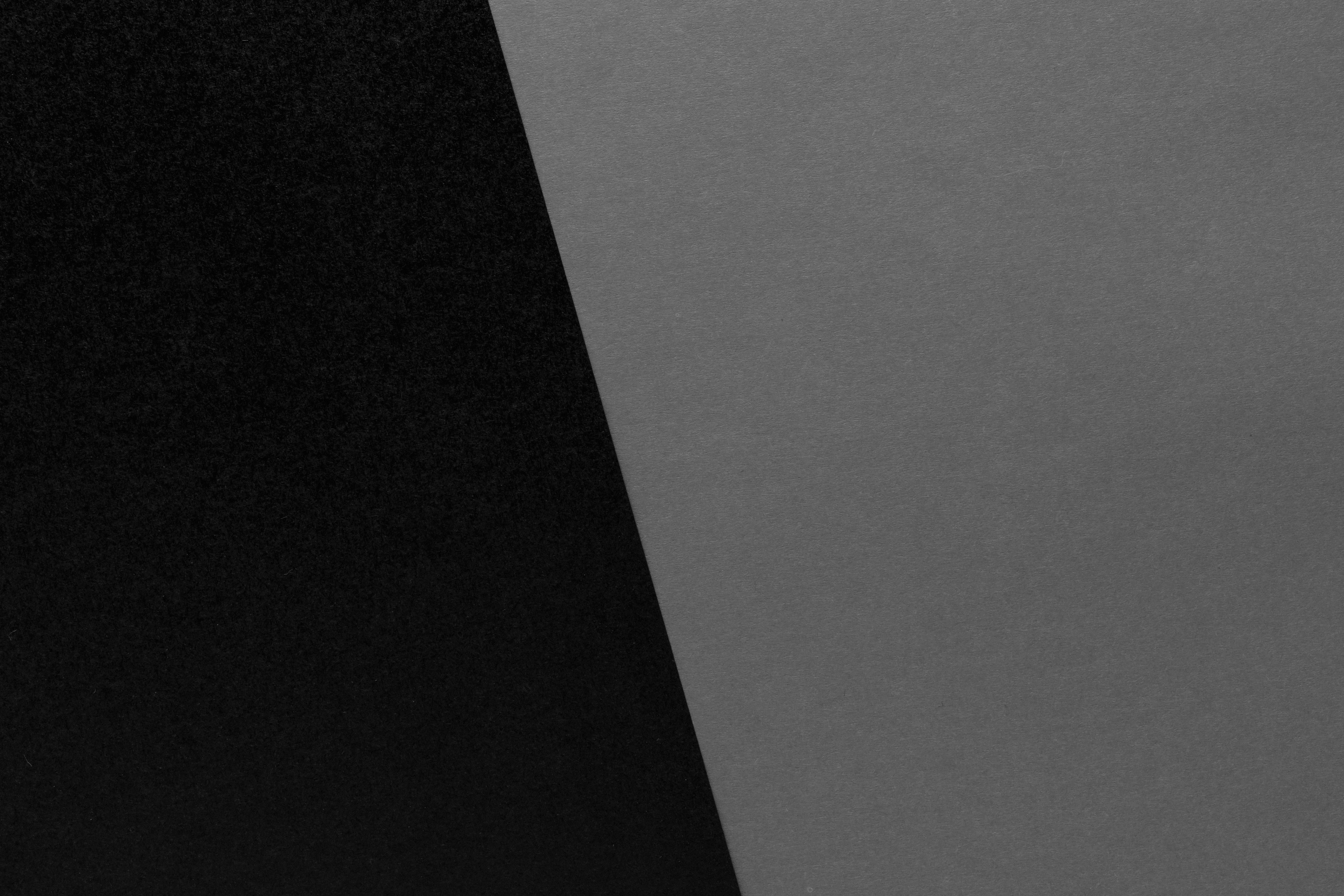 Two color, black and gray background. Texture of craft paper